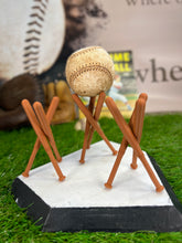 Three Darker Wood colored Ball Display Holders